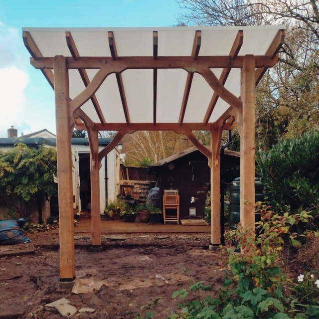 A beautiful wooden pergola with polycarb roof