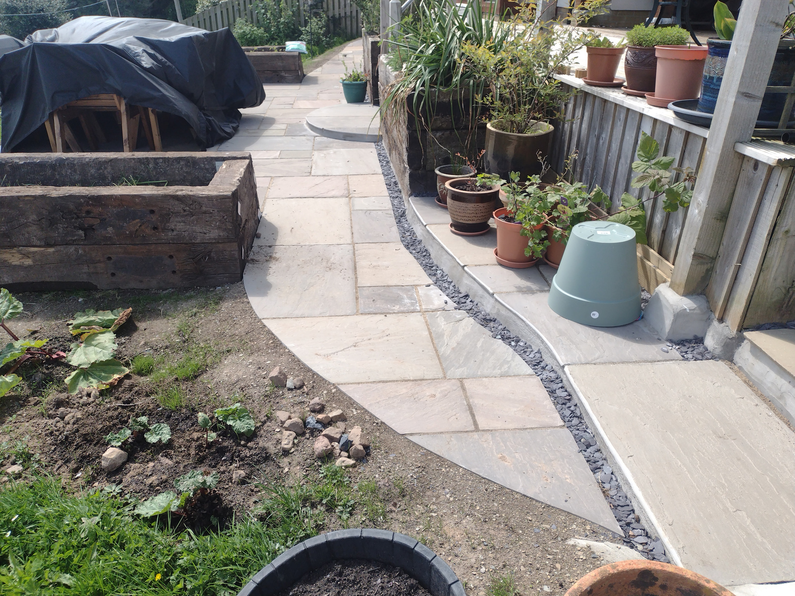 a curved path leading to a patio