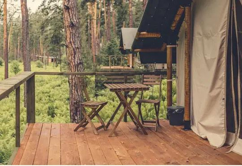 a decking in front of a tent